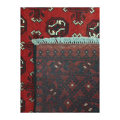 Reverse-weave and fringe detail of Afghan Turkoman wool rug showing back structure and hand-knotted pattern