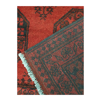 Reverse-weave and fringe detail of Afghan Turkoman wool rug showing back structure and hand-knotted pattern