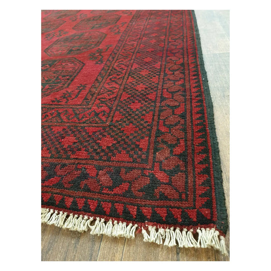 Angled detail of Turkoman rug showing border pattern, fringe, and hand-knotted wool texture, 291 x 203 cm