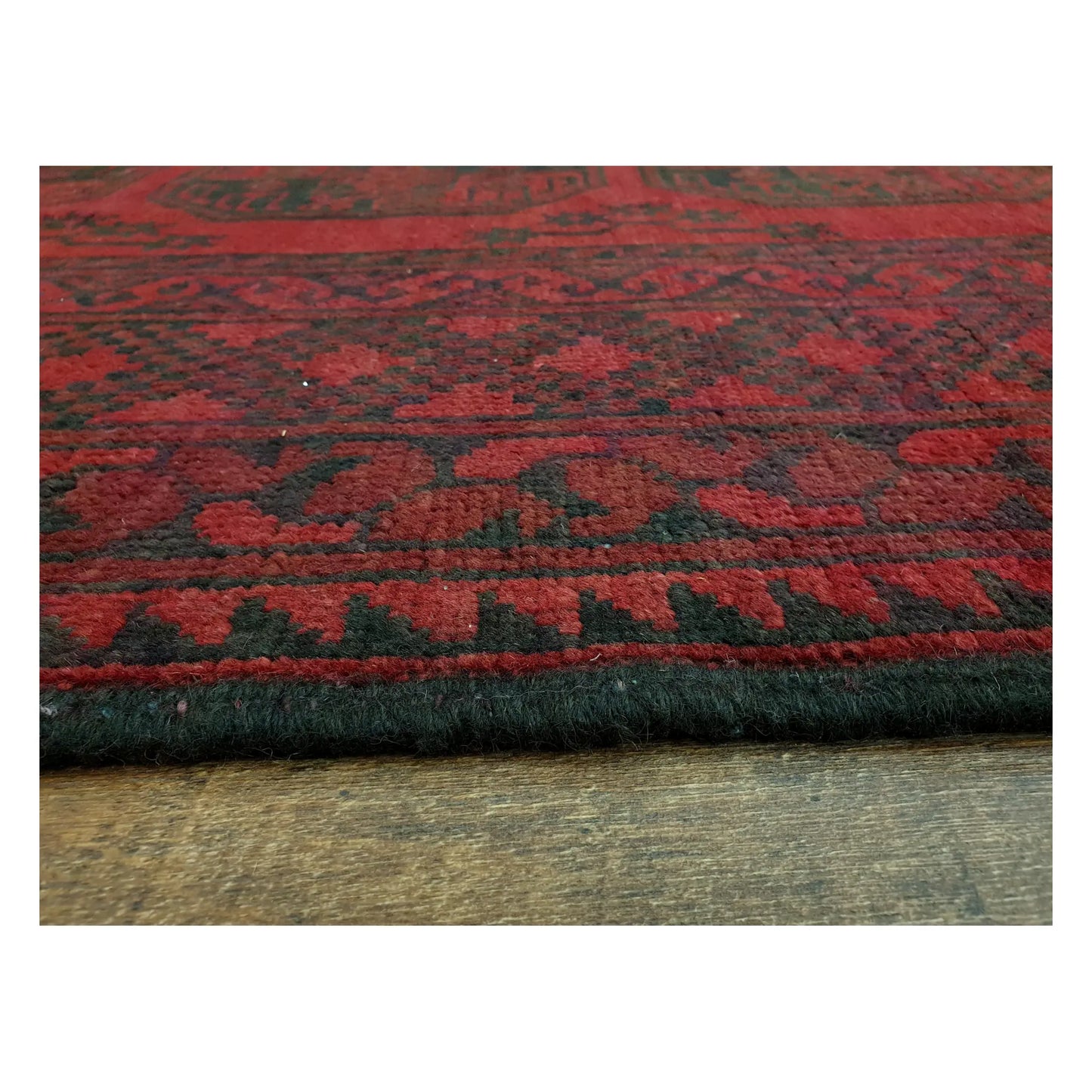 Low-angle close-up of Afghan Turkoman rug showing wool pile texture and geometric border detail, 291 x 203 cm