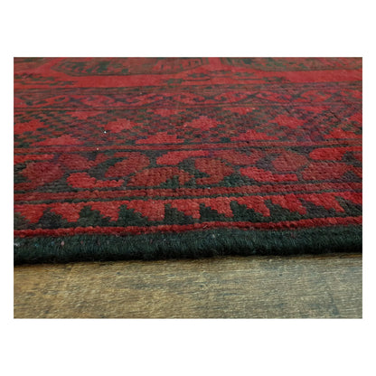 Low-angle close-up of Afghan Turkoman rug showing wool pile texture and geometric border detail, 291 x 203 cm