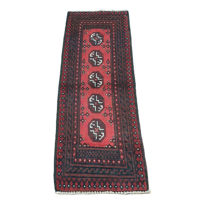 Full view of Afghan Turkoman hand-knotted wool runner rug with red field, five octagonal gul motifs and layered black borders, 130 x 52 cm