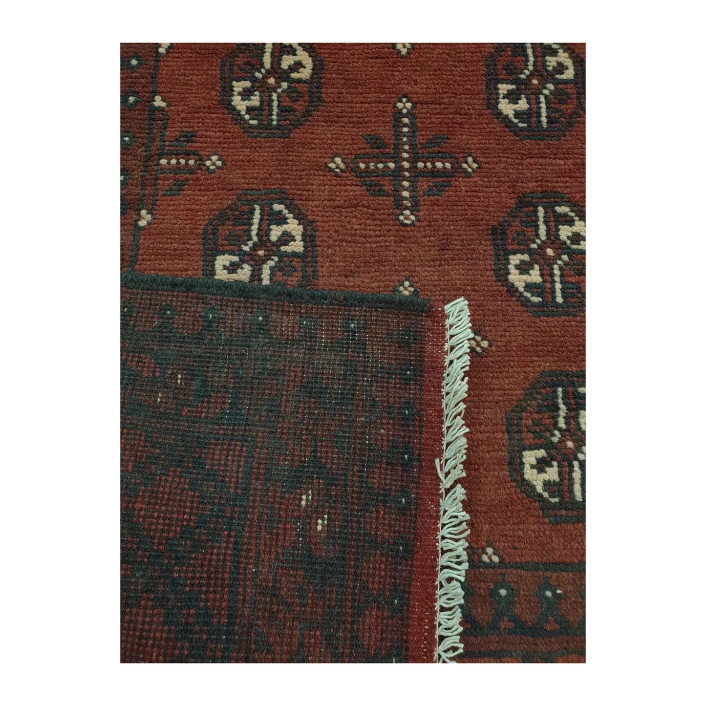 Close-up of Afghan Turkoman hand-knotted wool runner rug showing border detail, wool pile texture and traditional motifs, 193 x 104 cm