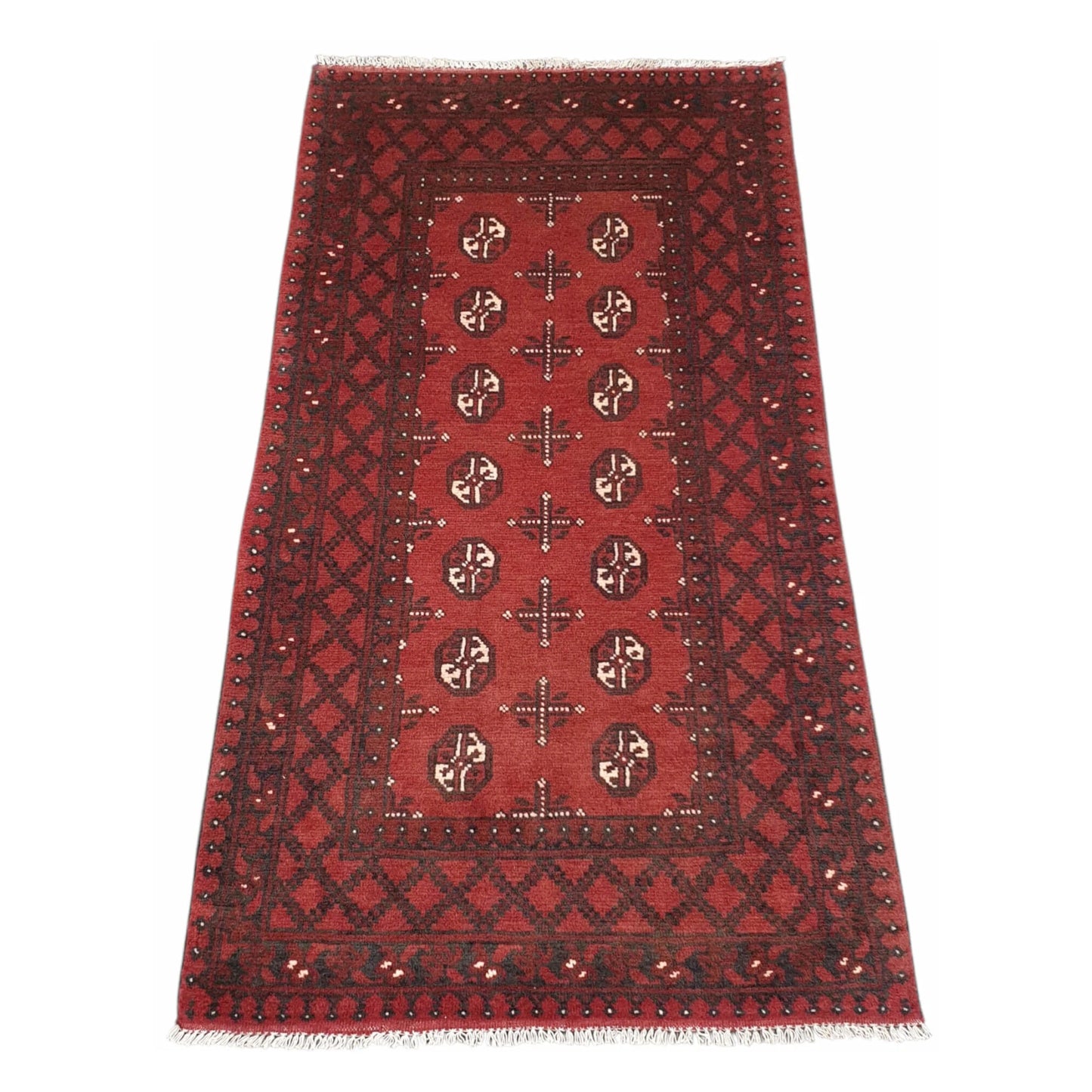 Full angled view of Afghan Turkoman hand-knotted wool runner rug with deep red tribal motifs and geometric border, 193 x 104 cm