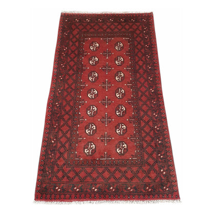 Full angled view of Afghan Turkoman hand-knotted wool runner rug with deep red tribal motifs and geometric border, 193 x 104 cm