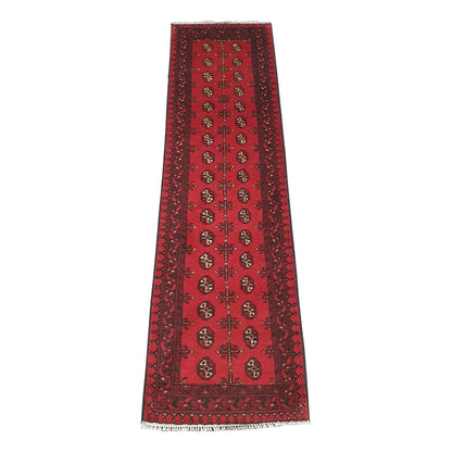 Full view of Afghan Turkoman hand-knotted wool runner rug with red field and repeated gul-style motifs, 236 x 64 cm