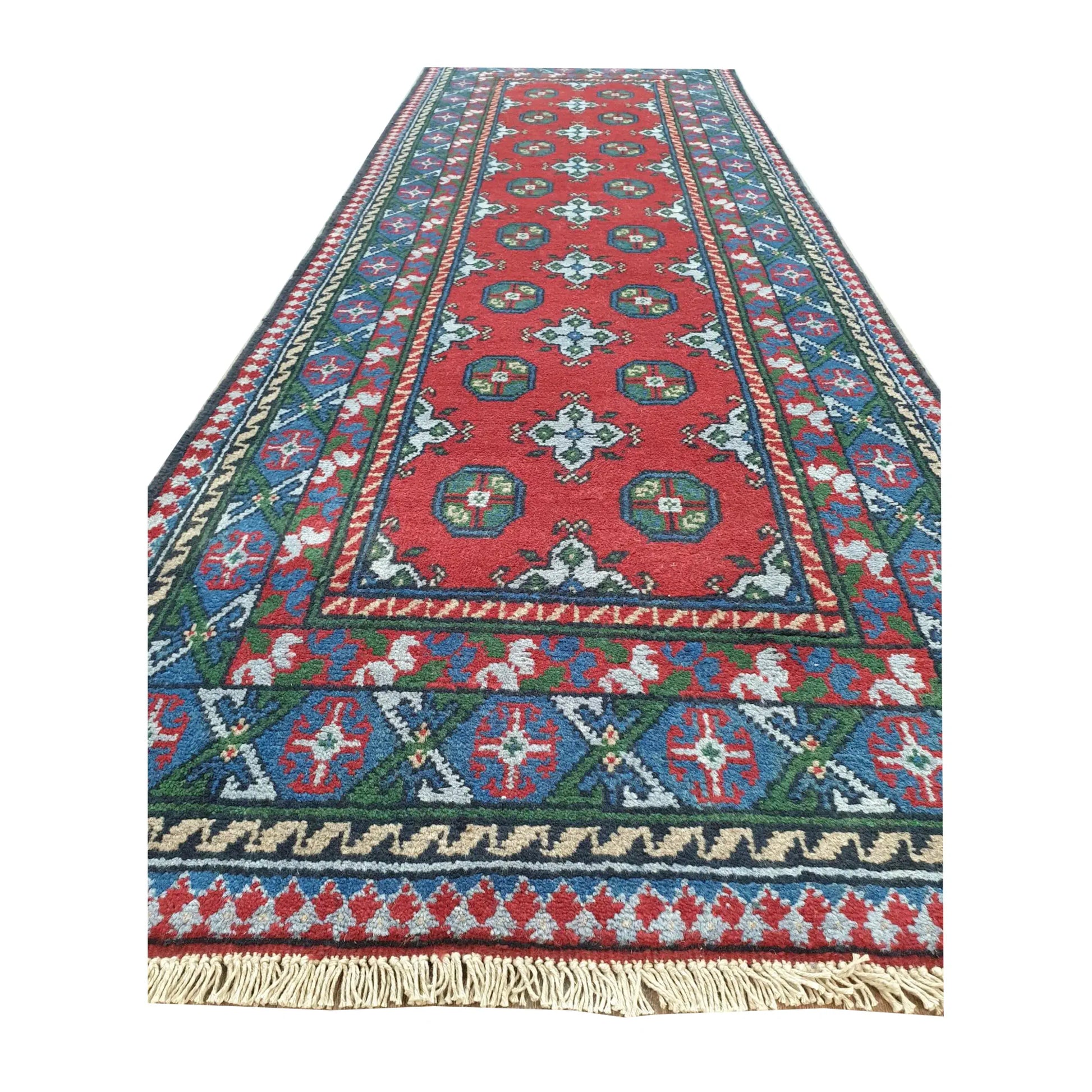 Border and fringe detail of Afghan Turkoman hand-knotted wool runner rug with red and deep blue geometric design