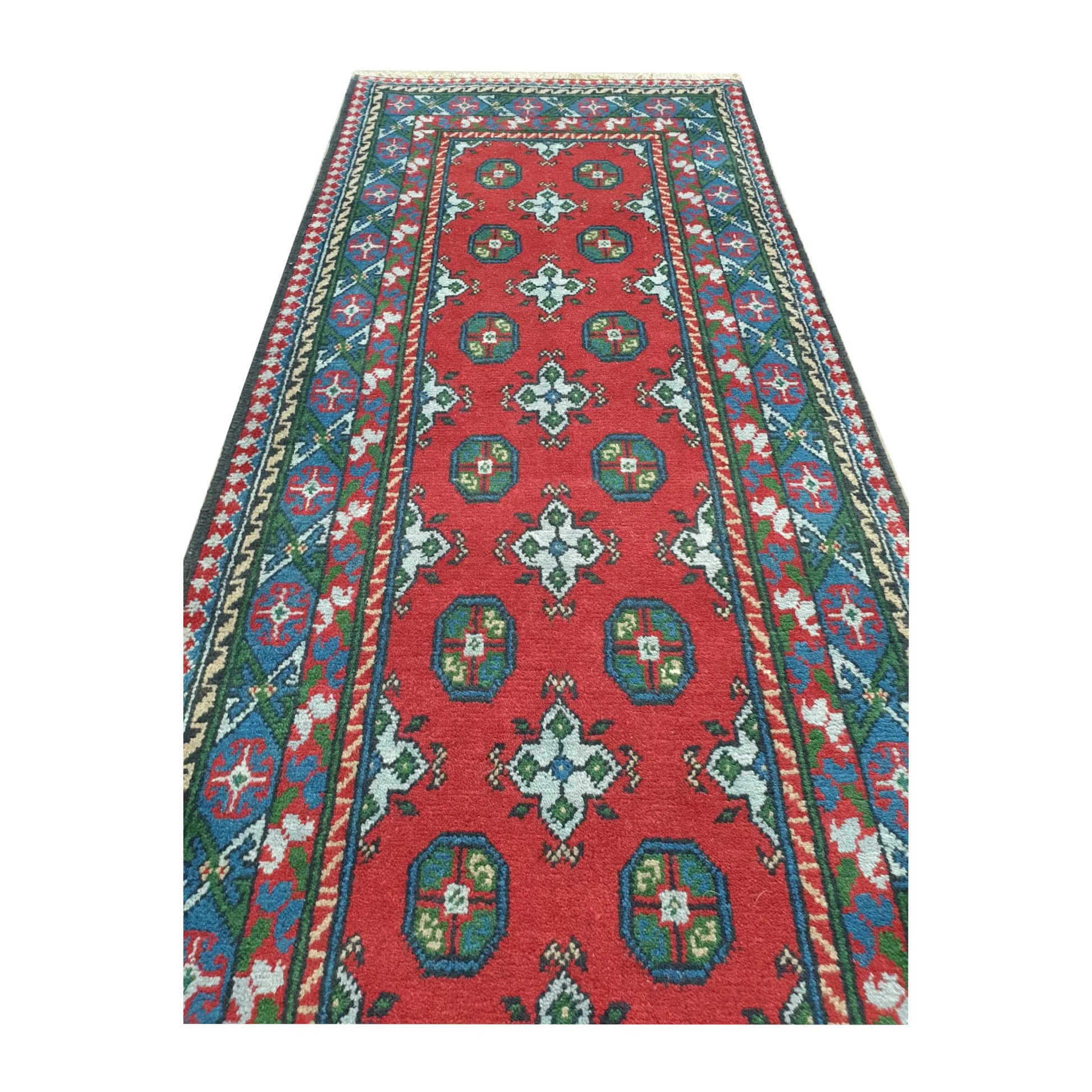 Field pattern detail of Afghan Turkoman runner rug showing repeated gul motifs and hand-knotted wool texture