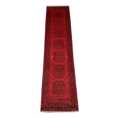 Full view of Afghan Turkoman hand-knotted wool runner rug with red field and repeated gul-style medallions, 283 x 67 cm
