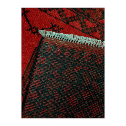 Reverse-weave and fringe detail of Afghan Turkoman wool runner rug showing back structure and hand-knotted pattern