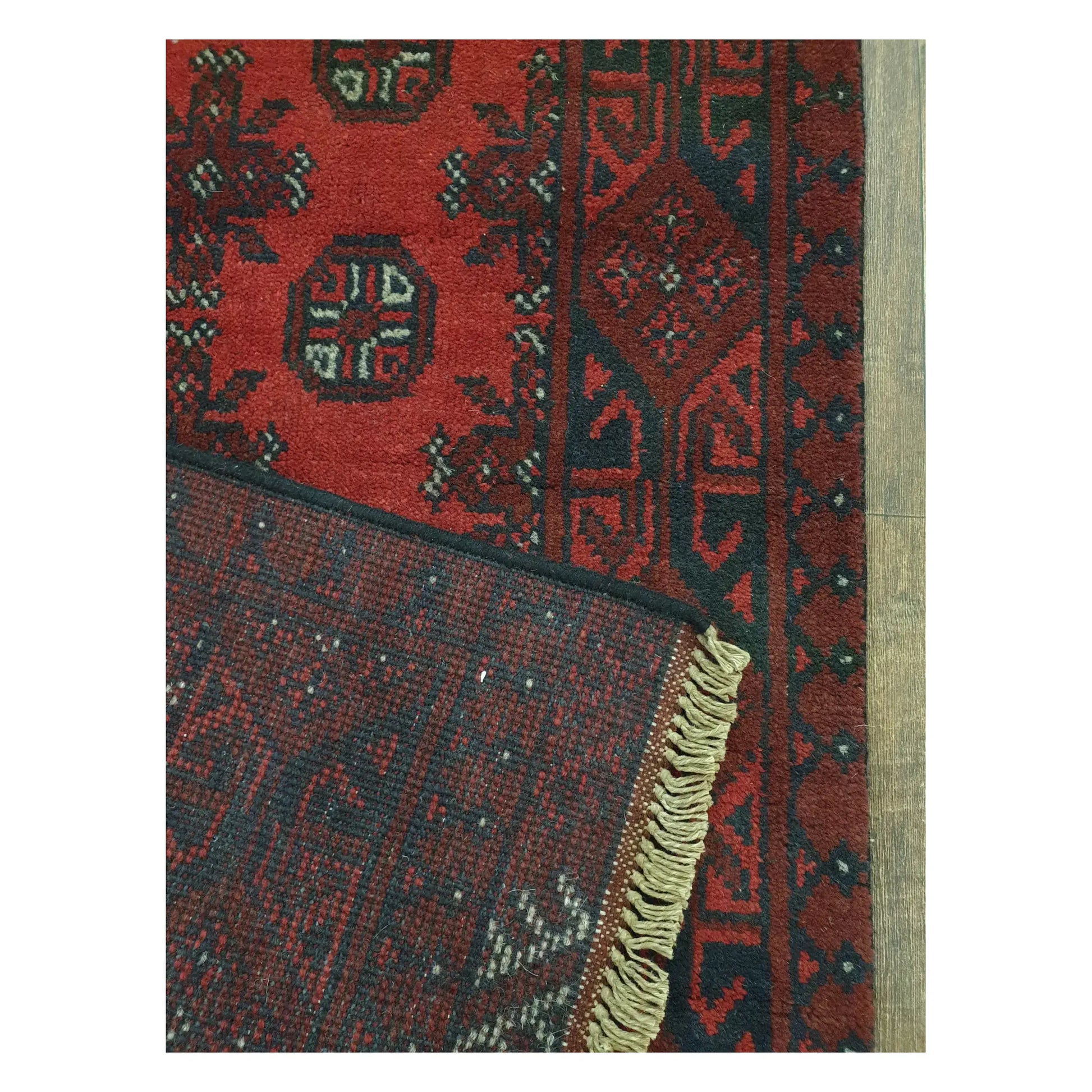 Corner detail of Afghan Turkoman runner showing front pattern and reverse weave, 568 x 75 cm