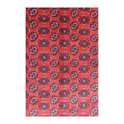 Field detail of the Afghan Turkoman rug showing octagonal guls alternating with taller angular motifs on red