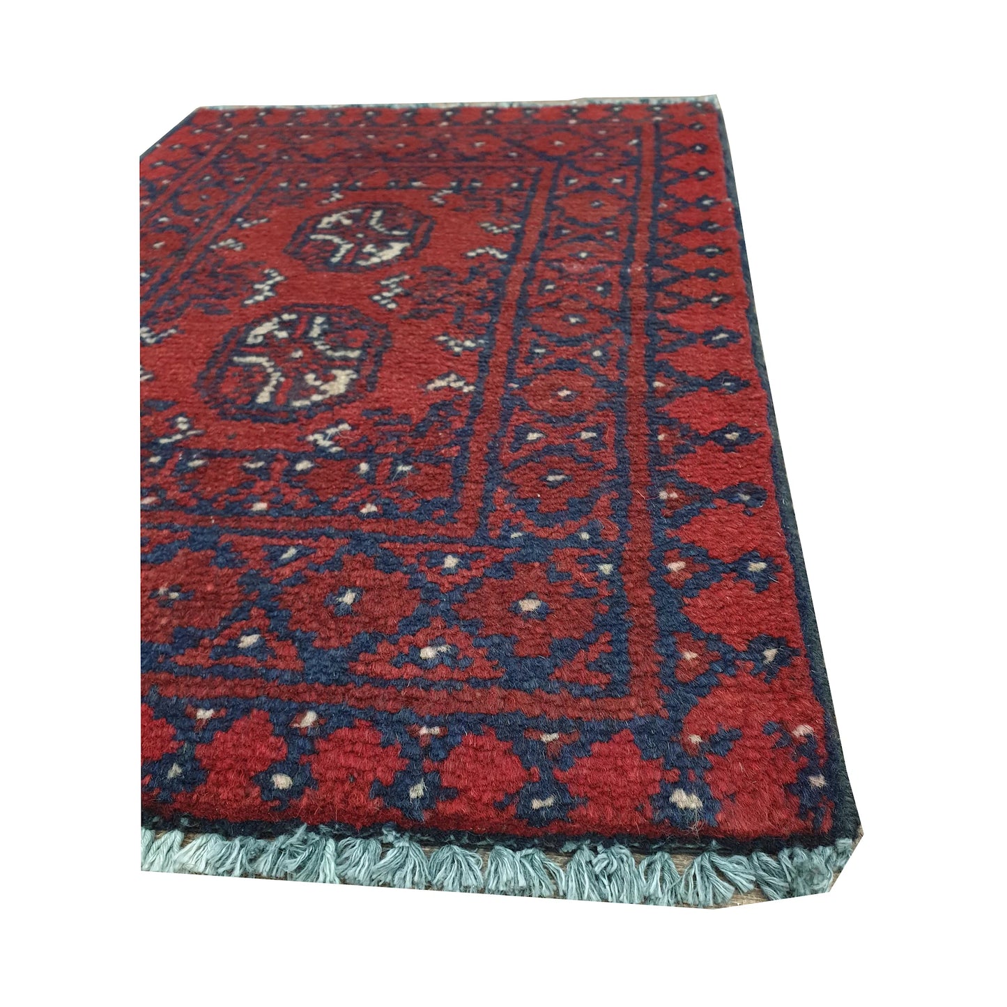 Fringe and border detail of Afghan Turkoman red wool rug showing navy edging, red field and traditional tribal motifs