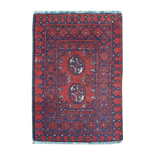 Afghan Turkoman red wool rug 66 x 48 cm full view with twin octagonal gul medallions and layered tribal border