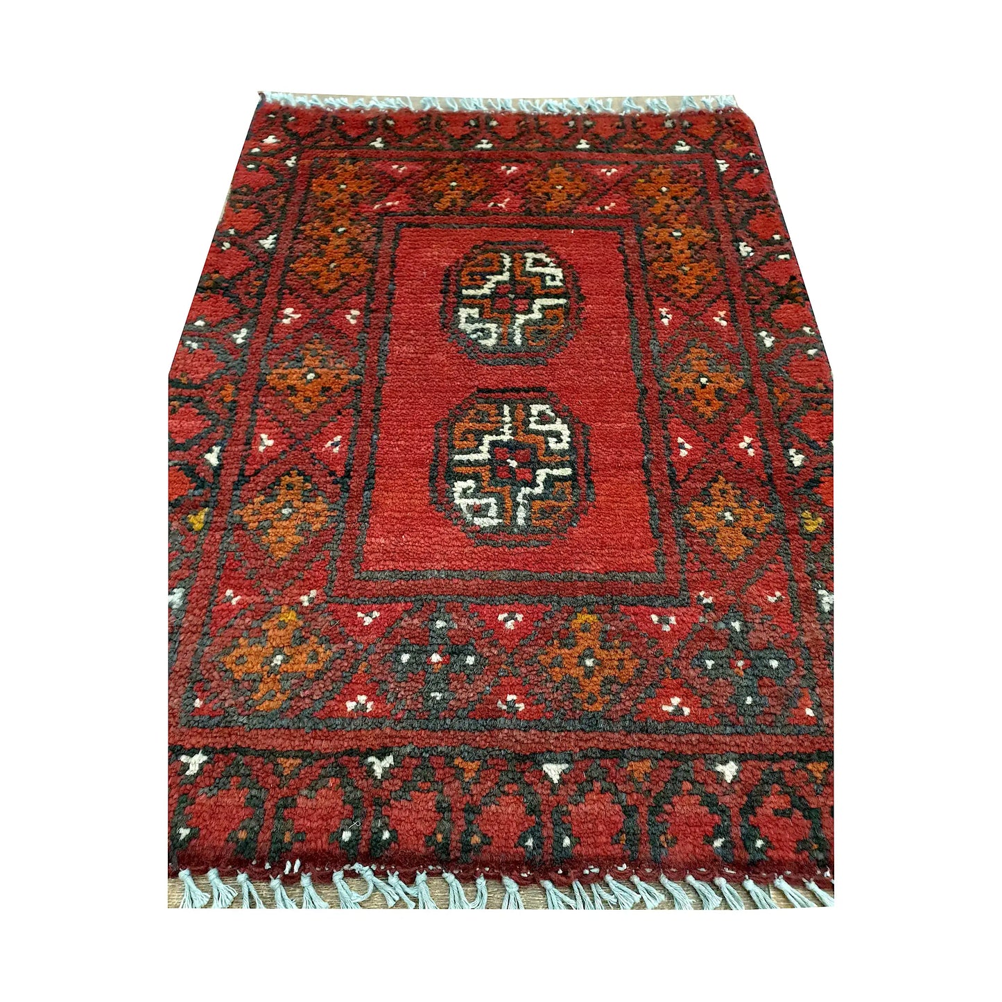 Afghan Turkoman red wool rug detail showing twin octagonal gul medallions within a framed tribal field