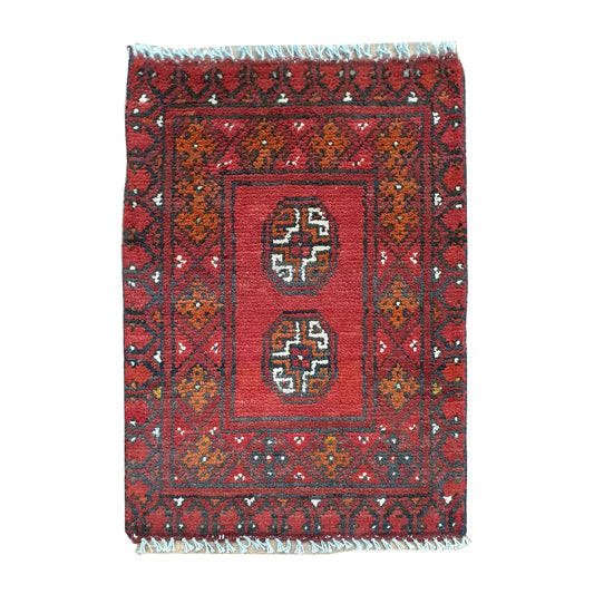 Afghan Turkoman red wool rug 66 x 50 cm full view with twin octagonal gul medallions and dark tribal border