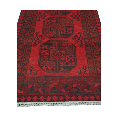 End field and fringe detail of Afghan Turkoman rug with red gul panel and charcoal tribal border pattern