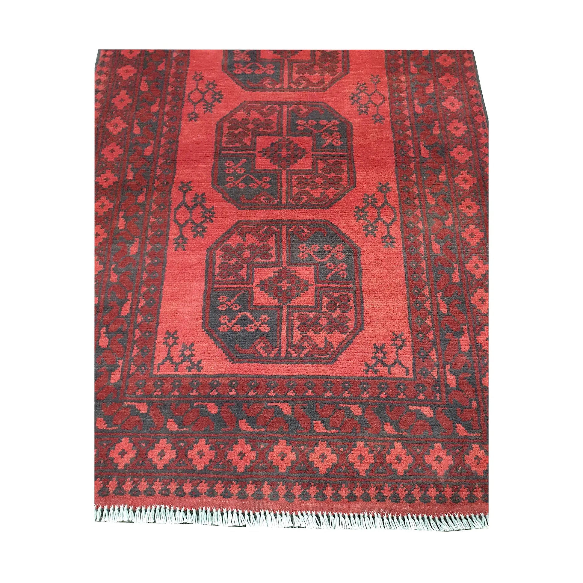 End field and fringe detail of Afghan Turkoman rug with red gul panel and charcoal border pattern