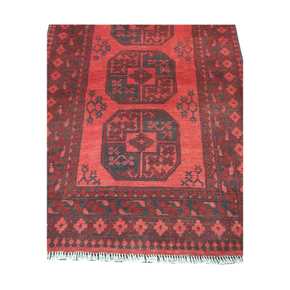 End field and fringe detail of Afghan Turkoman rug with red gul panel and charcoal border pattern