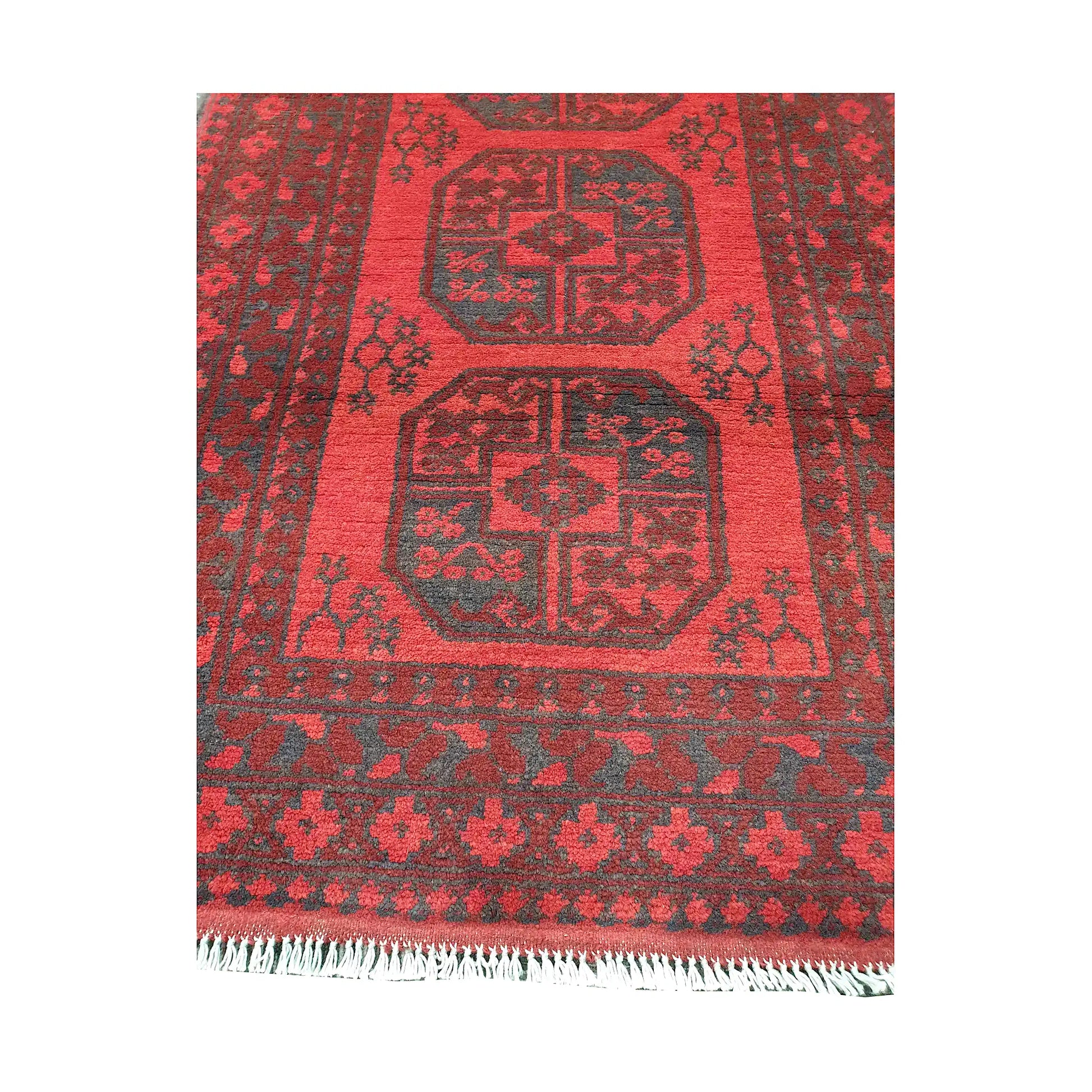 End field and fringe detail of Afghan Turkoman rug with red gul field and charcoal tribal border pattern