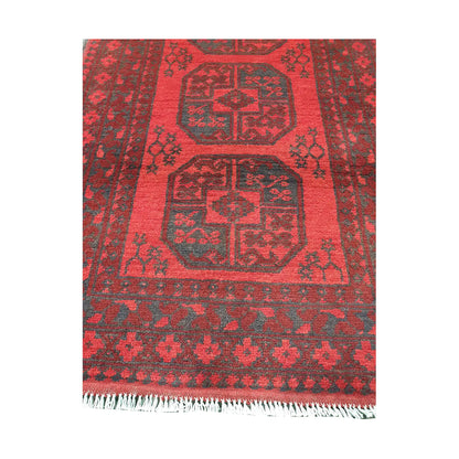 End field and fringe detail of Afghan Turkoman rug with red gul field and charcoal tribal border pattern