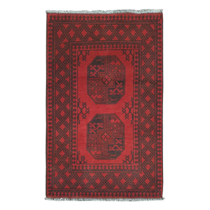 Afghan Turkoman rug 121 x 75 cm full view with red field, dark border and two central gul motifs