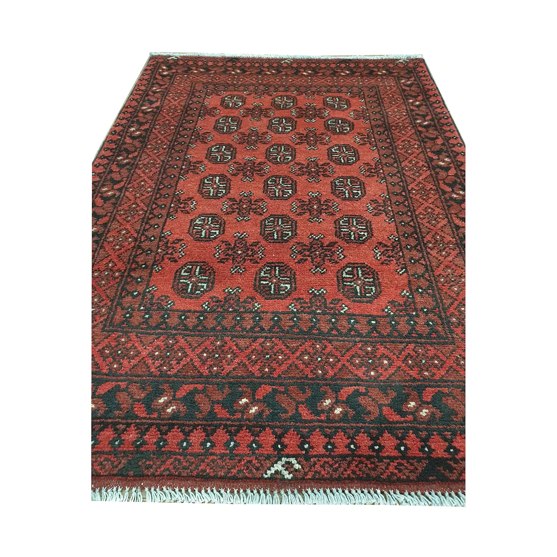 End field and fringe detail of Afghan Turkoman rug with red ground, repeated gul medallions and dark border