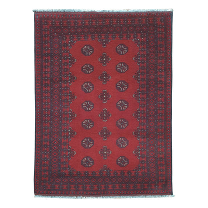Afghan Turkoman rug 145 x 100 cm full view with open red field, dark border and repeated gul medallions