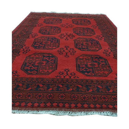 End field and fringe detail of Afghan Turkoman rug with red ground, repeated gul motifs and dark tribal border