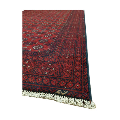 Angled border and fringe detail of Afghan Turkoman rug showing deep red wool pile, charcoal edging and tribal motifs