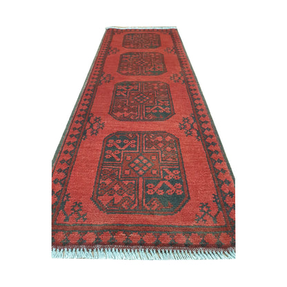 End field and fringe detail of Afghan Turkoman runner rug with red ground, four gul medallions and dark border