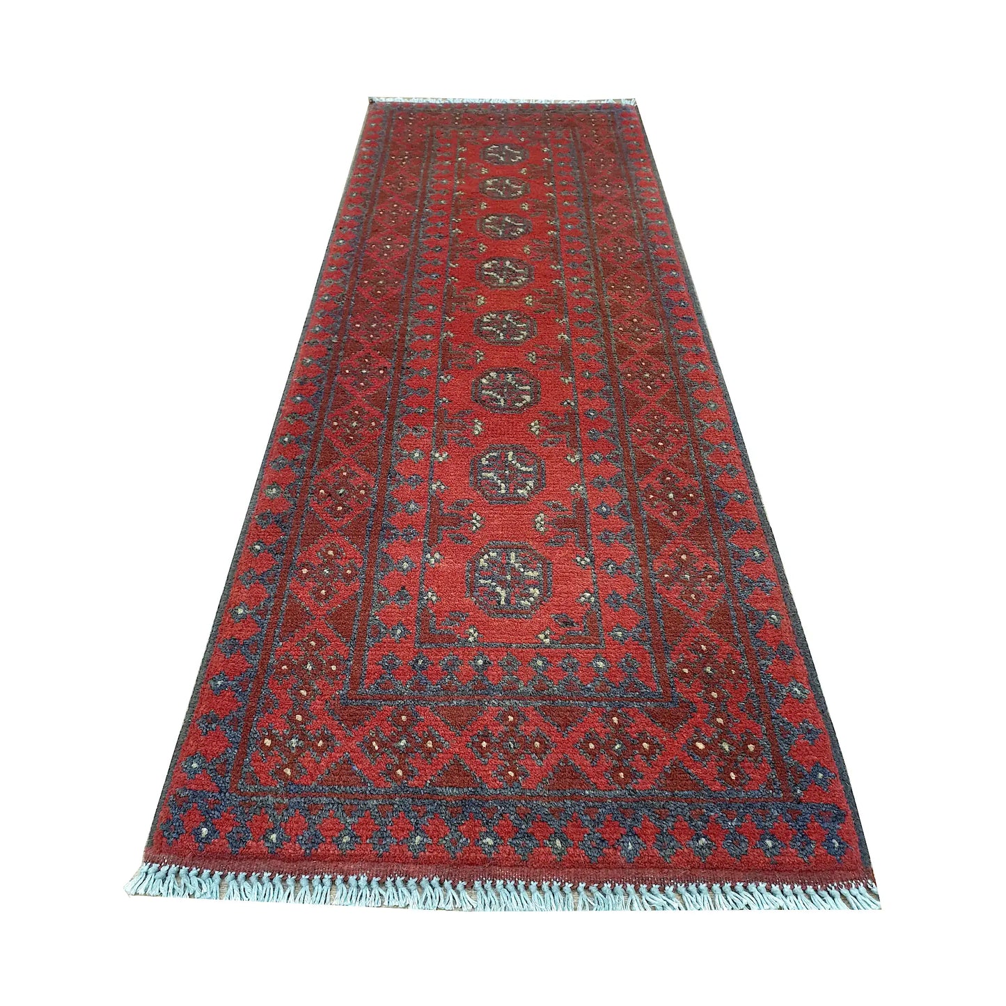 End field and fringe detail of Afghan Turkoman runner rug with repeated gul medallions, red ground and dark border