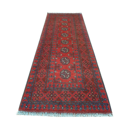 End field and fringe detail of Afghan Turkoman runner rug with repeated gul medallions, red ground and dark border