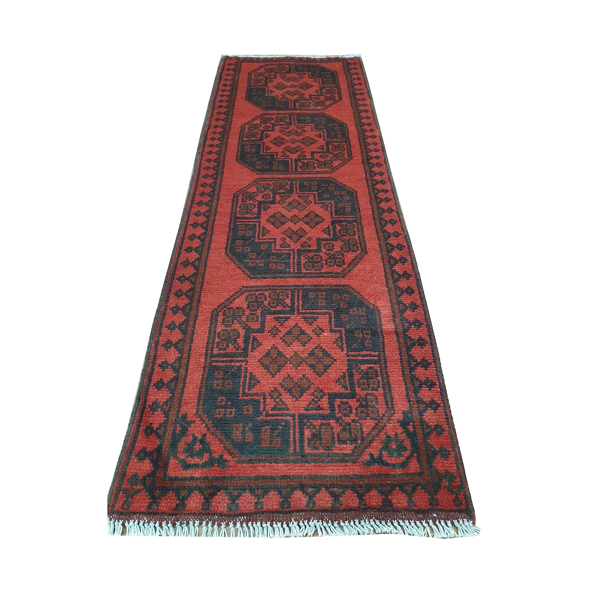 End field detail of Afghan Turkoman runner rug with octagonal gul medallions, geometric border and visible fringe
