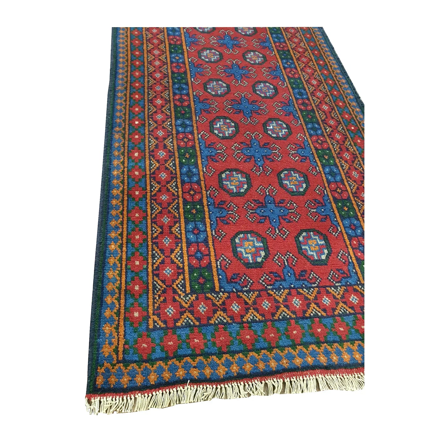 Angled close view of the geometric field, layered borders and cream fringe