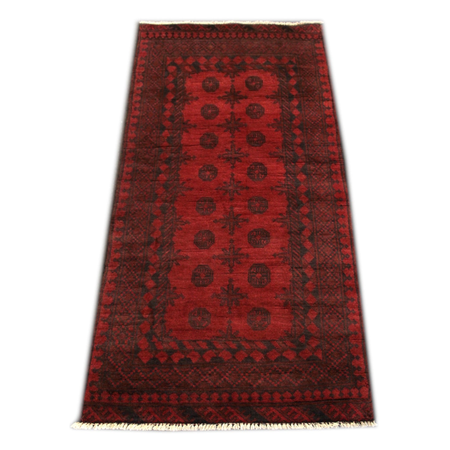Full view of Afghan Turkoman wool rug with deep red field and repeating gul motifs, 197 x 92 cm
