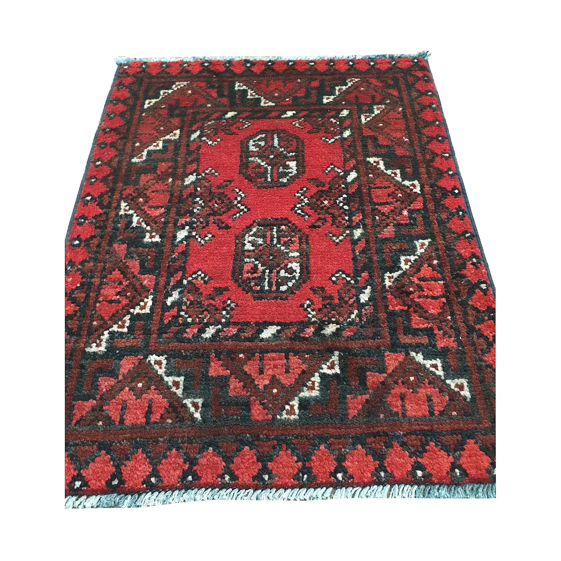 Afghan Turkoman wool rug detail showing twin gul medallions, red field and angular tribal border