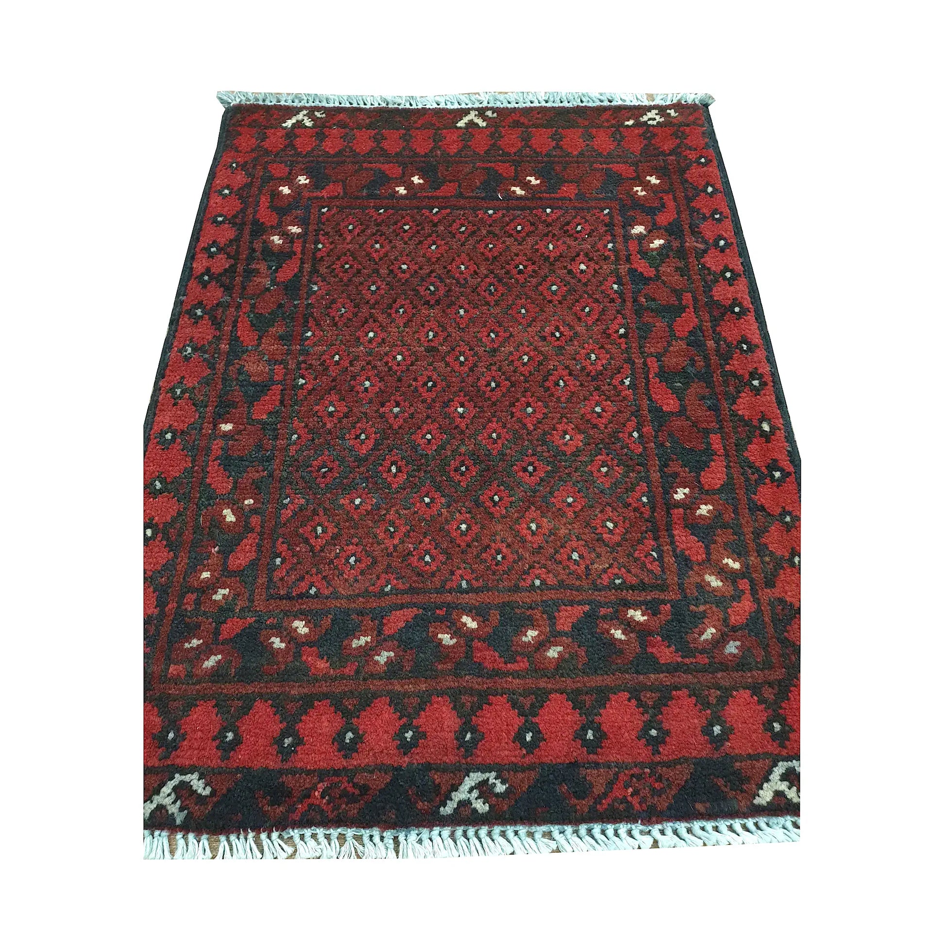 Afghan Turkoman wool rug detail showing a dense miniature gul lattice framed by geometric tribal borders