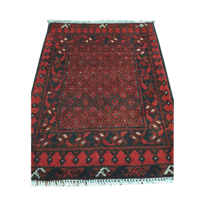 Afghan Turkoman wool rug detail showing a dense miniature gul lattice framed by geometric tribal borders