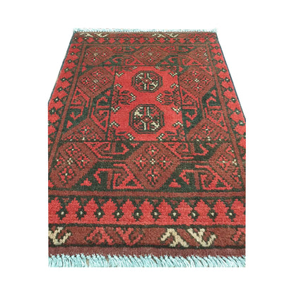 Front view of Afghan Turkoman wool rug showing paired gul medallions and layered tribal borders