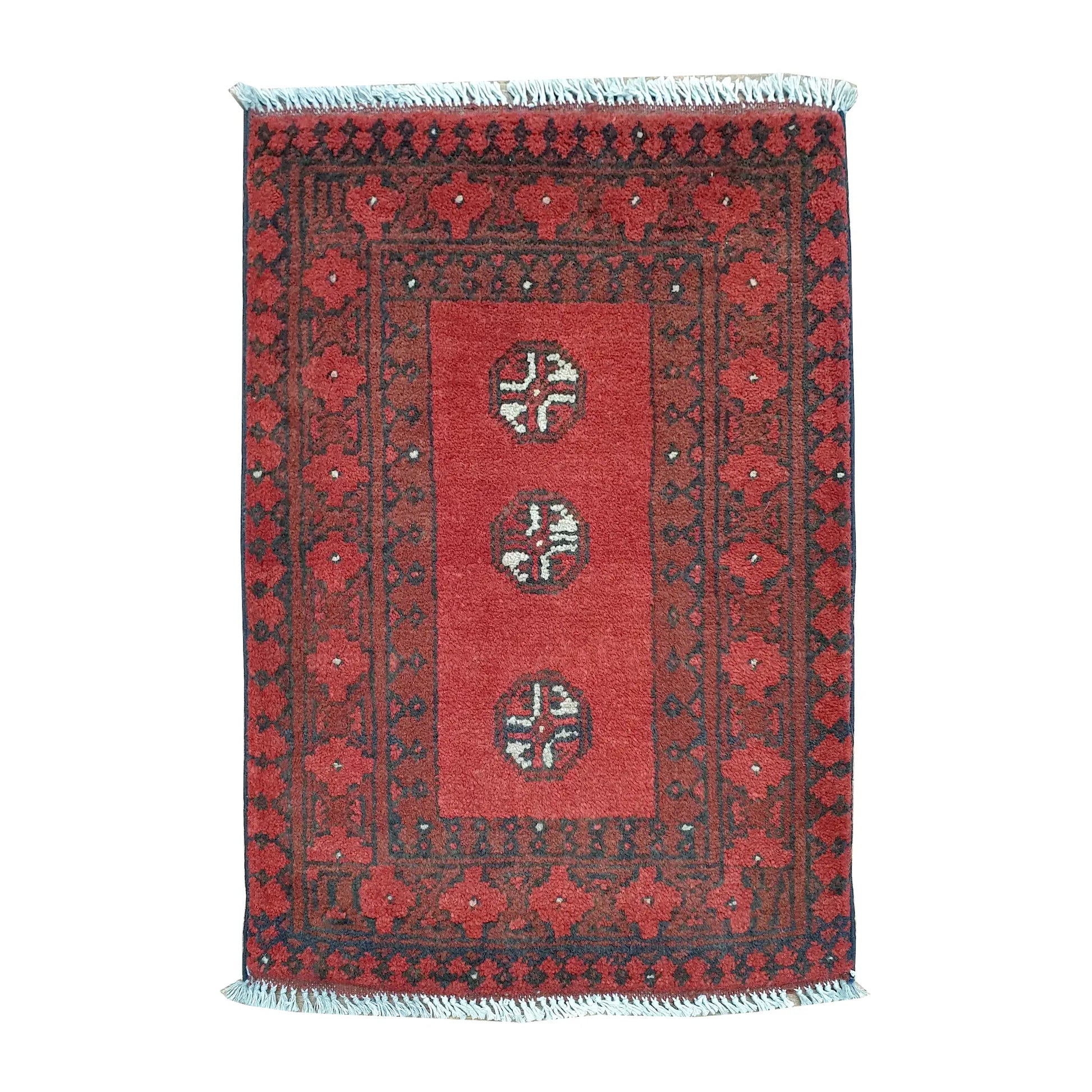 Afghan Turkoman wool rug 70 x 52 cm full view with open red field, three quartered guls and broad tribal borders