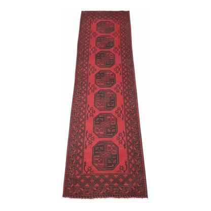 Full view of Afghan Turkoman wool runner rug with deep red field and stacked gul motifs, 280 x 79 cm