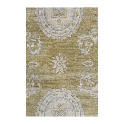 Close-up of Ziegler rug with a pale oval medallion, central floral rosette and ivory vine motifs