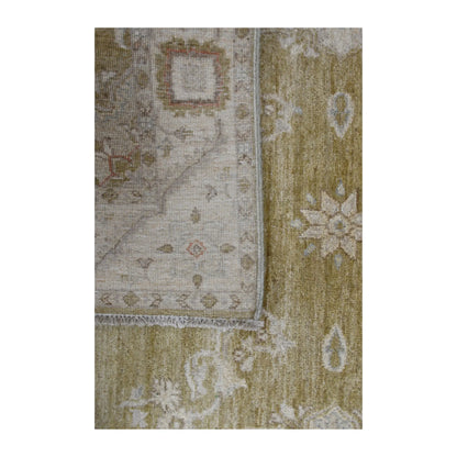 Folded-corner detail of Afghan Ziegler rug showing the reverse weave, olive-beige front and ivory floral motifs
