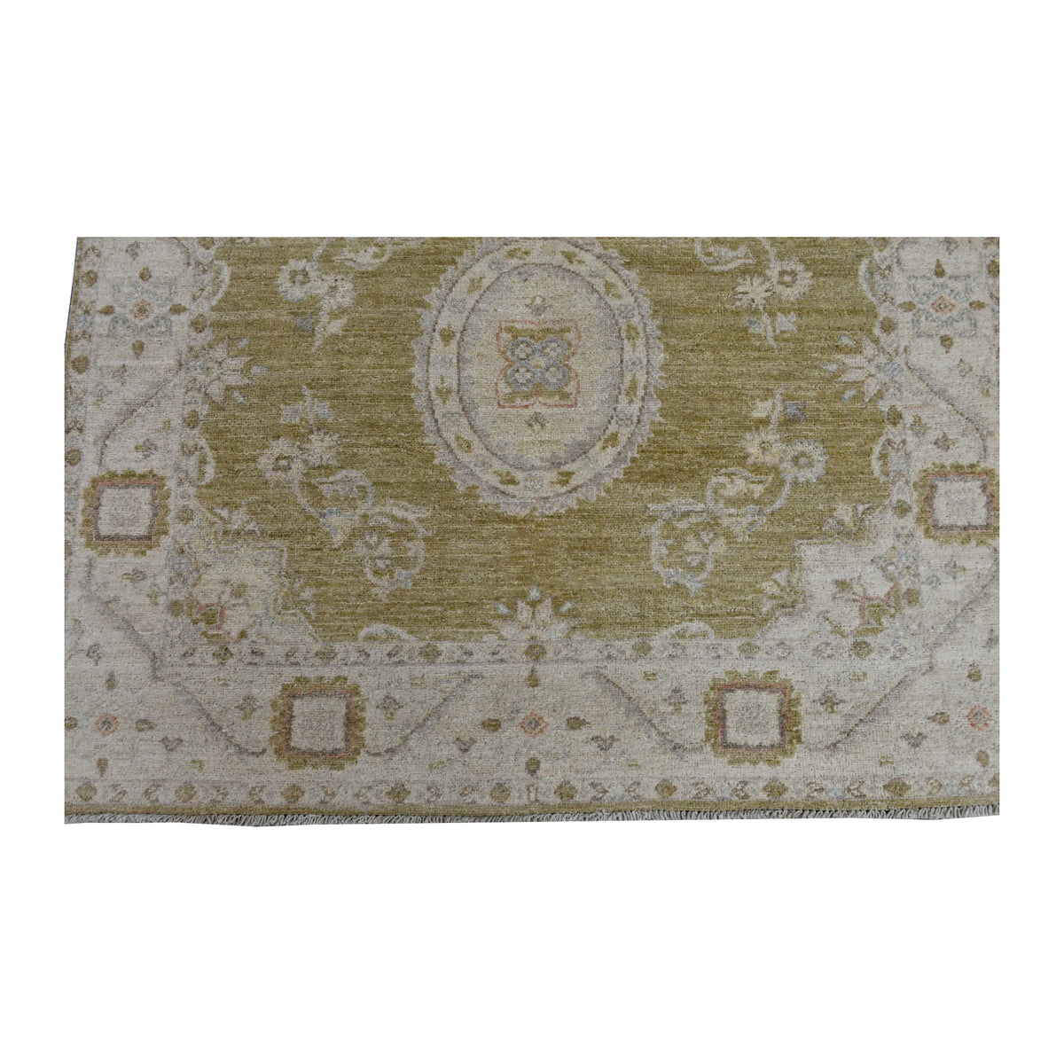 Fringe and end-border detail of Ziegler rug with an oval floral medallion, ivory framing and muted gold accents