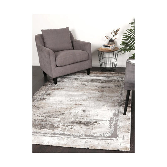 Antep 23314 975 Grey White modern rug styled with chair and indoor décor, showing soft neutral distressed pattern, 230 x 160 cm