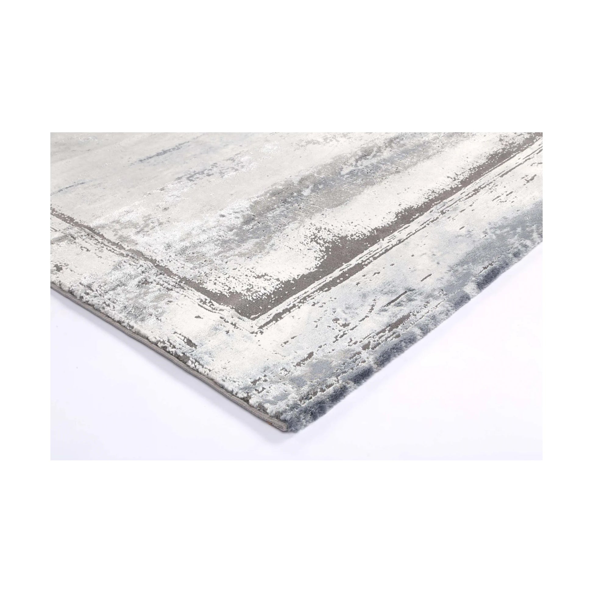 Corner detail of Antep 23314 Grey modern rug showing bound edge, white grey pattern and soft textured pile, 230 x 160 cm