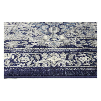 Border texture detail of Arya navy traditional rug showing ivory floral pattern