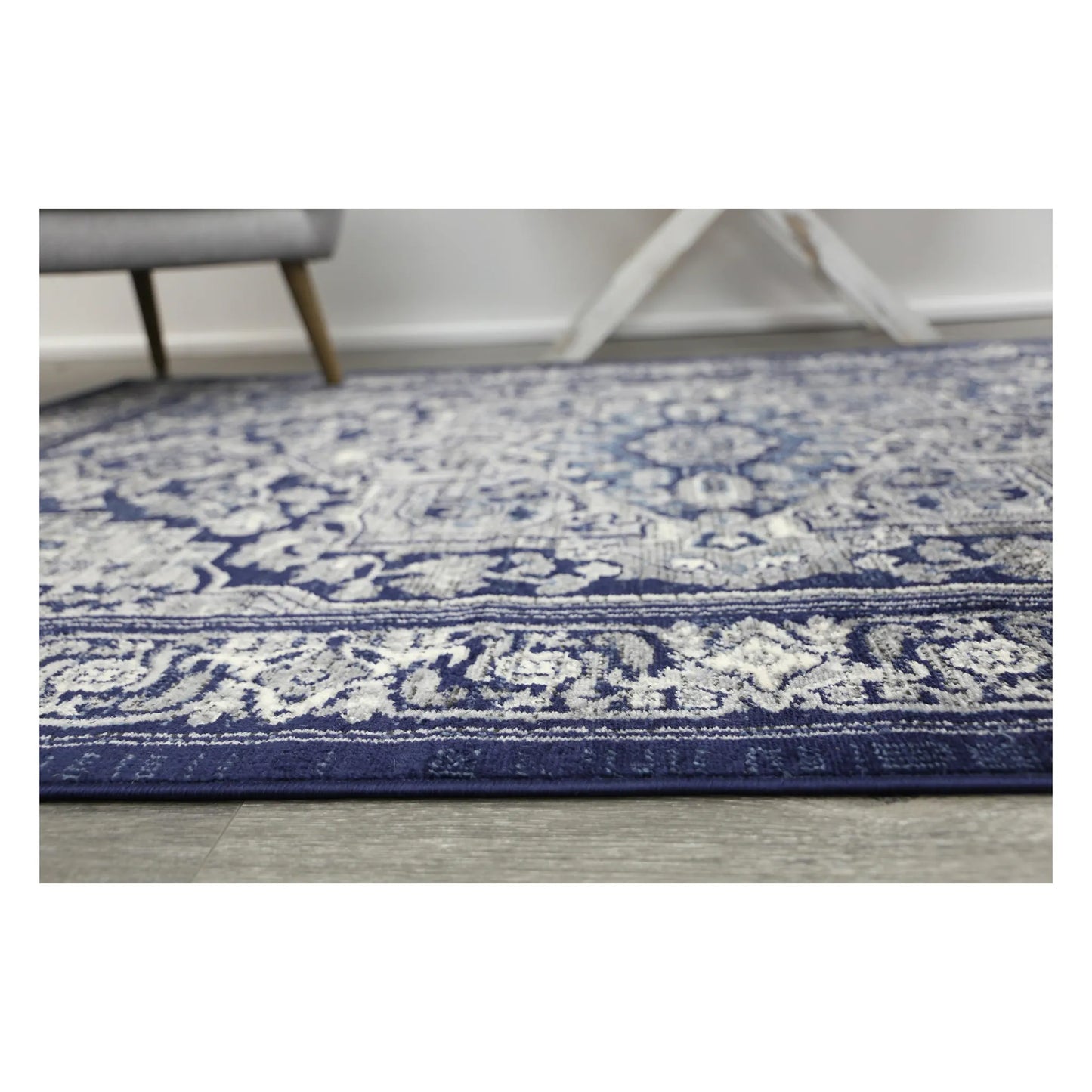 Edge pattern detail of Arya navy rosette traditional rug with floral border design