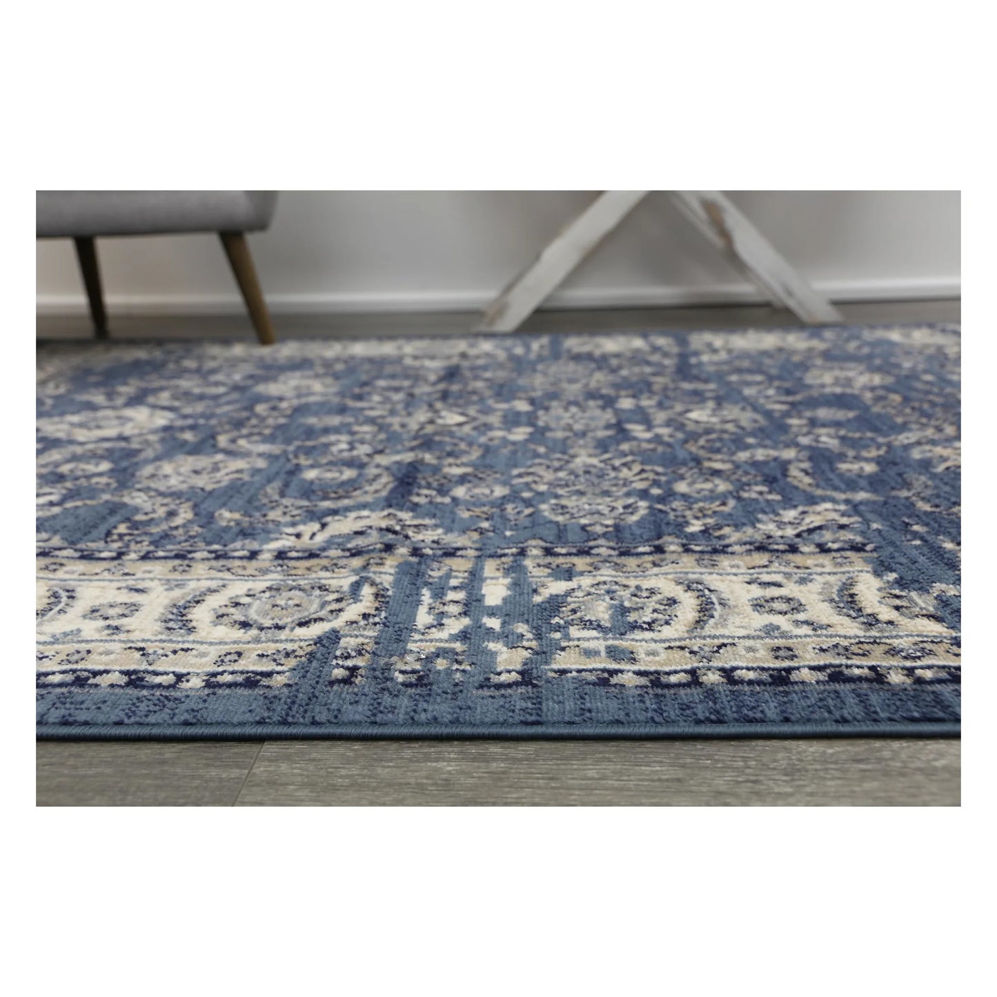 Edge pattern detail of Arya blue traditional rug with floral border design